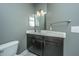 Modern bathroom vanity with dark wood cabinet, and updated fixtures at 2244 Ashley Crossing Drive Dr # 621, Charleston, SC 29414