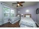 Charming bedroom with twin beds, decorative mirrors, and a ceiling fan at 2244 Ashley Crossing Drive Dr # 621, Charleston, SC 29414