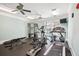 Exercise room featuring modern equipment, ceiling fans, and natural light from two windows at 2244 Ashley Crossing Drive Dr # 621, Charleston, SC 29414