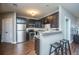 Modern kitchen with stainless steel appliances, granite countertops, and dark wood cabinets at 2244 Ashley Crossing Drive Dr # 621, Charleston, SC 29414