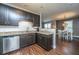 Well-equipped kitchen with granite countertops, stainless appliances, and adjacent dining area at 2244 Ashley Crossing Drive Dr # 621, Charleston, SC 29414