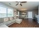 Open-concept living room with couch, fan, and view of dining area, great for entertaining at 2244 Ashley Crossing Drive Dr # 621, Charleston, SC 29414