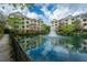 Beautiful community pond with fountain, surrounded by lush greenery and apartments at 2244 Ashley Crossing Drive Dr # 621, Charleston, SC 29414