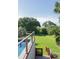 Beautiful backyard with a view and a stunning pool, surrounded by mature trees at 2407 Atlantic Ave, Sullivans Island, SC 29482