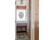 Rustic bathroom featuring wood walls, a vessel sink, and vintage mirror at 2407 Atlantic Ave, Sullivans Island, SC 29482