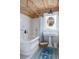 Bright bathroom featuring a classic tub, pedestal sink, and subway tile at 2407 Atlantic Ave, Sullivans Island, SC 29482