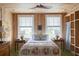 Bright bedroom with natural wood walls and large windows at 2407 Atlantic Ave, Sullivans Island, SC 29482