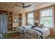 Shared bedroom with twin beds, wood paneling, and built-in shelving at 2407 Atlantic Ave, Sullivans Island, SC 29482