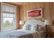 Light-filled bedroom with rustic wood walls and a vintage sign at 2407 Atlantic Ave, Sullivans Island, SC 29482