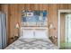 Stylish bedroom with wood paneling and eclectic artwork above the bed at 2407 Atlantic Ave, Sullivans Island, SC 29482