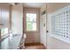 Charming butler pantry with stylish cabinets, countertops, a window, and colorful star art at 2407 Atlantic Ave, Sullivans Island, SC 29482