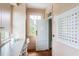 Charming butler pantry with stylish cabinets, countertops, a window, and a view to the hallway at 2407 Atlantic Ave, Sullivans Island, SC 29482