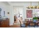 Inviting dining room features a wood table, bright lighting, and colorful accents at 2407 Atlantic Ave, Sullivans Island, SC 29482