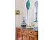 The buffet in this dining room has decorative accents and artwork at 2407 Atlantic Ave, Sullivans Island, SC 29482