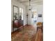 Charming entryway featuring wooden floors, a stylish dresser, and eclectic decorations for a welcoming ambiance at 2407 Atlantic Ave, Sullivans Island, SC 29482