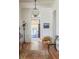 Elegant entryway with a decorative sheep and vintage rug, leading to a cozy sitting area with refined accents at 2407 Atlantic Ave, Sullivans Island, SC 29482