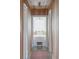 Charming hallway showcasing wood paneling and a cozy window seat at 2407 Atlantic Ave, Sullivans Island, SC 29482