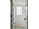 Bright hallway with white paneled walls and staircase at 2407 Atlantic Ave, Sullivans Island, SC 29482