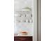 Open shelving displays kitchenware and decorative items at 2407 Atlantic Ave, Sullivans Island, SC 29482