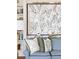 Bright sitting room with blue couch, art and bookshelves at 2407 Atlantic Ave, Sullivans Island, SC 29482
