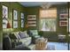 Comfortable living room features a cozy seating arrangement, nautical art, and natural light at 2407 Atlantic Ave, Sullivans Island, SC 29482