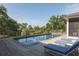 Stunning pool with clear water, lounge chairs, and a beautiful view of lush greenery at 2407 Atlantic Ave, Sullivans Island, SC 29482