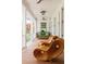 Relaxing porch with stylish wicker chairs and a comfortable swing, perfect for enjoying the serene outdoor views at 2407 Atlantic Ave, Sullivans Island, SC 29482