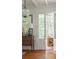 Inviting porch featuring a comfortable swing and decorative lamp, offering a relaxing outdoor space at 2407 Atlantic Ave, Sullivans Island, SC 29482