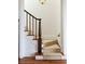 Close up of a bright staircase with wood banister and carpet runner at 2407 Atlantic Ave, Sullivans Island, SC 29482