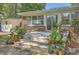 Cozy back porch features a seating area and an abundance of potted plants at 2645 Mona Ave, Charleston, SC 29414