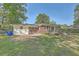 Picture of the backyard with a brick house and a well maintained lawn at 2645 Mona Ave, Charleston, SC 29414