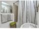 Well-maintained bathroom with a tub, shower, and decorative tile at 2645 Mona Ave, Charleston, SC 29414