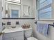Well-lit bathroom with a classic tile, a clean white vanity and fixtures at 2645 Mona Ave, Charleston, SC 29414