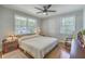 Cozy bedroom with hardwood floors, a ceiling fan, and bright natural light at 2645 Mona Ave, Charleston, SC 29414