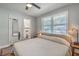 Cozy bedroom featuring a large window, neutral colors, and an ensuite bathroom at 2645 Mona Ave, Charleston, SC 29414