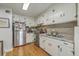 Functional kitchen featuring stainless steel appliances, tile backsplash and light cabinets at 2645 Mona Ave, Charleston, SC 29414