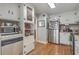 Traditional eat-in kitchen with stainless appliances, granite countertops, and light wood flooring at 2645 Mona Ave, Charleston, SC 29414