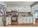 A kitchen with white cabinetry, stainless steel appliances, and a stylish backsplash at 2645 Mona Ave, Charleston, SC 29414
