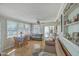A well-lit living room with wood floors, neutral walls, and large windows at 2645 Mona Ave, Charleston, SC 29414