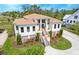 Aerial view of a stylish home featuring a three-story design, lush landscaping, and a private driveway at 2732 Canebreak Ln, Mount Pleasant, SC 29466