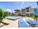 Beautiful backyard featuring a pool, hot tub, and lounge chairs with views of the home's architecture at 2732 Canebreak Ln, Mount Pleasant, SC 29466