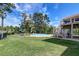 Expansive backyard with a pool, hot tub, and lush green lawn, perfect for outdoor activities at 2732 Canebreak Ln, Mount Pleasant, SC 29466