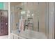 Bathroom with glass shower doors, towel rack and aqua tiled stripe accents at 2732 Canebreak Ln, Mount Pleasant, SC 29466