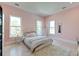 Well lit bedroom with a large bed, hardwood floors and multiple windows at 2732 Canebreak Ln, Mount Pleasant, SC 29466