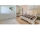 Bedroom with bed, plaid throw, large mirror and jute rug at 2732 Canebreak Ln, Mount Pleasant, SC 29466