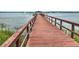 Long wooden neighborhood dock leading out over the water at 2732 Canebreak Ln, Mount Pleasant, SC 29466
