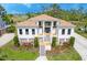 Beautiful two-story home with lush landscaping, a manicured lawn, and an inviting front entrance and walkway at 2732 Canebreak Ln, Mount Pleasant, SC 29466