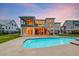 Rear exterior view of the home featuring a swimming pool and a multi-level deck at 2732 Canebreak Ln, Mount Pleasant, SC 29466