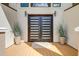 Inviting front entrance features double doors, sconce lighting and lovely planters at 2732 Canebreak Ln, Mount Pleasant, SC 29466