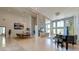 Open living space with dining area, piano, high ceilings, and plenty of natural light at 2732 Canebreak Ln, Mount Pleasant, SC 29466